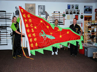 Mike Receives School Banner from Master Lee